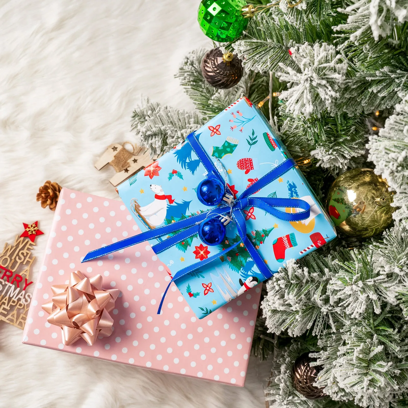 Northern Christmas Wrapping Paper Roll with White Polka Dots Printed on Pink Background
